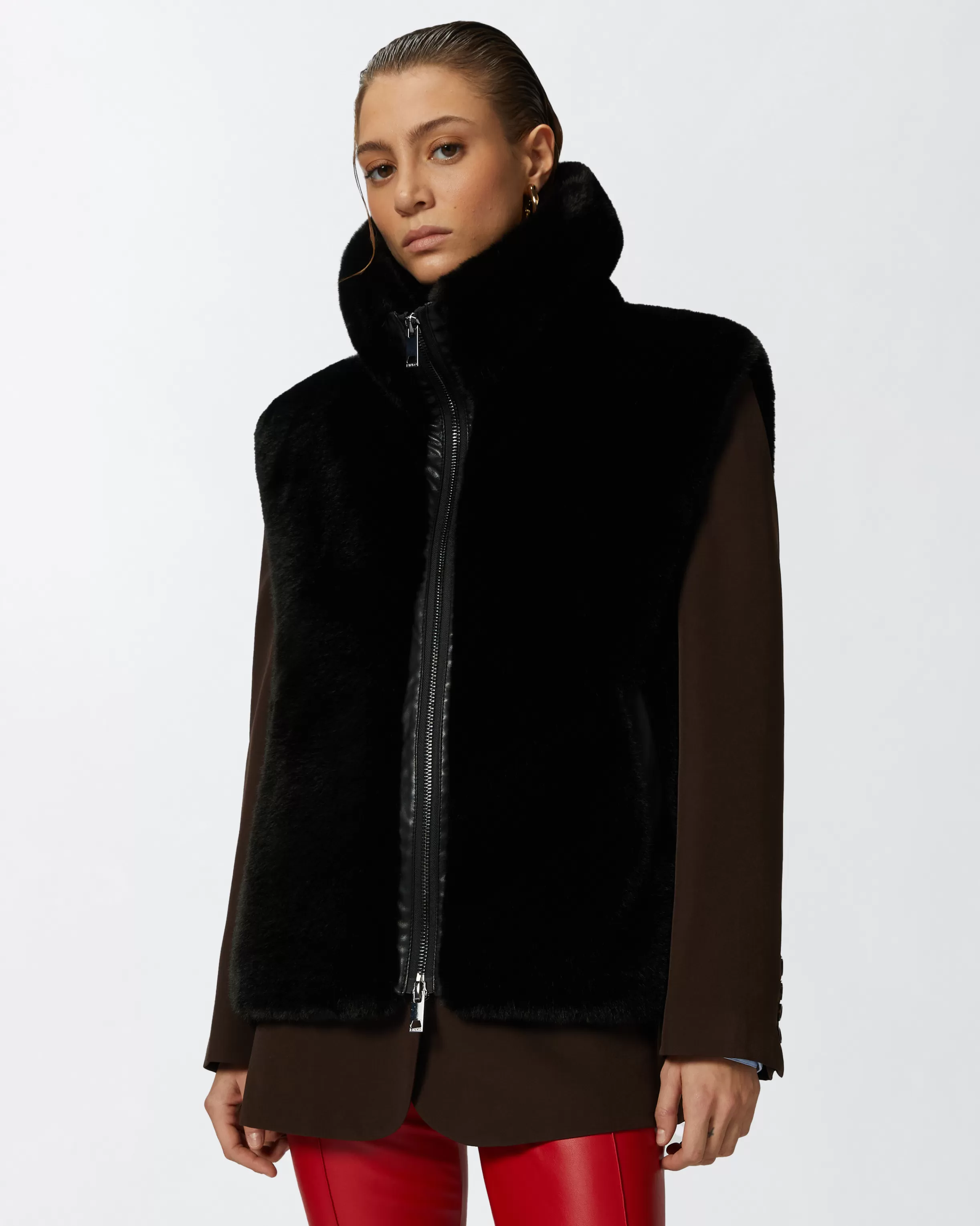 PINKO Sleeveless faux fur jacket with high collar.