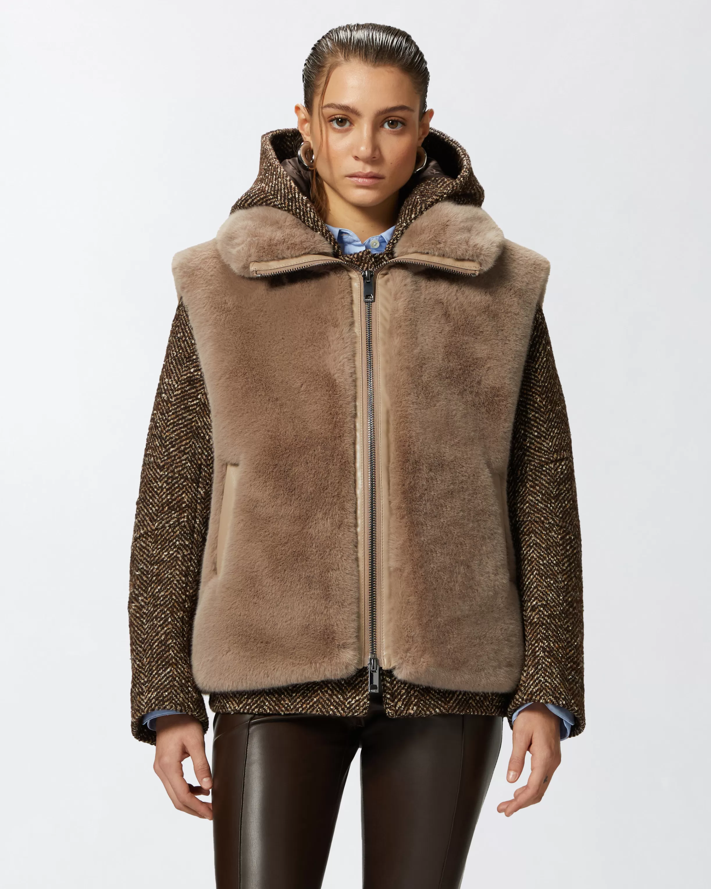 PINKO Sleeveless faux fur jacket with high collar.